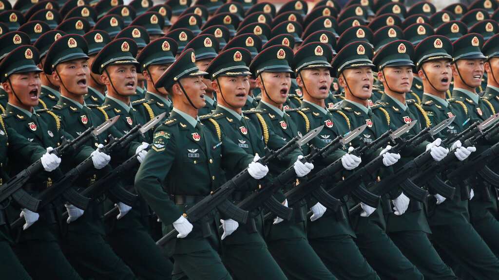 China to raise defence spending as Beijing adopts tougher language against Taiwan on reunification
