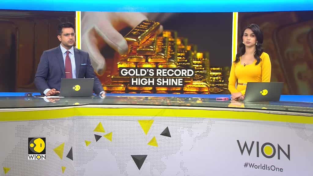 Gold climbs to record even as momentum builds on rate-cut bets