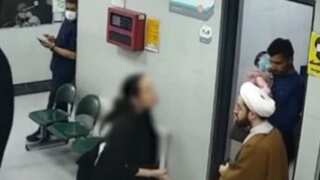 Watch: Iranian woman without hijab gets into a scuffle with cleric for clicking her picture