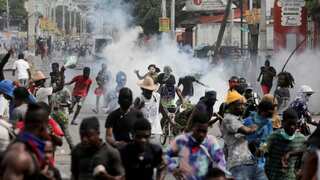 Haiti violence claims dozen lives in affluent neighbourhoods as Caribbean nation teeters on brink of collapse