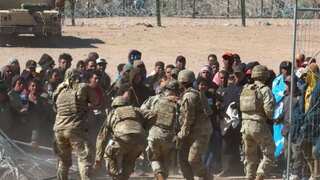 Watch: Wild scene on US border as 100 migrants hit guards and burst through razor wire