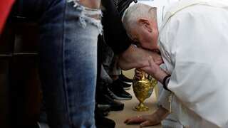 Pope Francis, on wheelchair, washes and kisses feet of female prisoners in ritual ahead of Easter