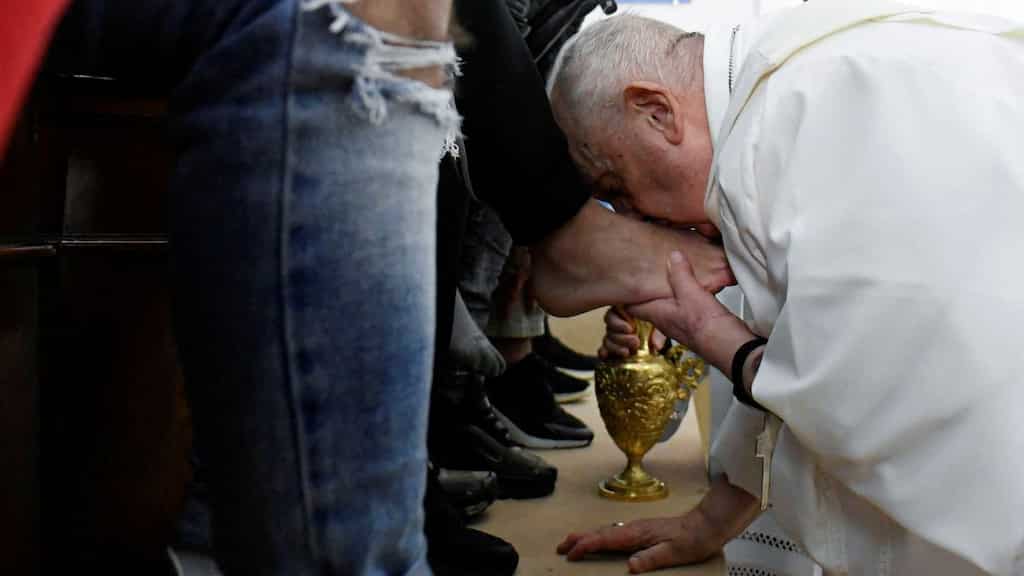 Pope Francis, on wheelchair, washes and kisses feet of female prisoners in ritual ahead of Easter