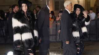 Cher arrives at Dolce & Gabbana exhibition with beau Alexander Edwards