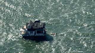 In pics: Massive two-storey houseboat towed across San Francisco bay