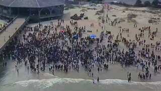 Georgia beach town sues unpermitted party promoters amid ‘Orange Crush’ festival overcrowding