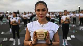 'Feel like a beautiful bird': Mass yoga session takes place on Bangkok airport tarmac