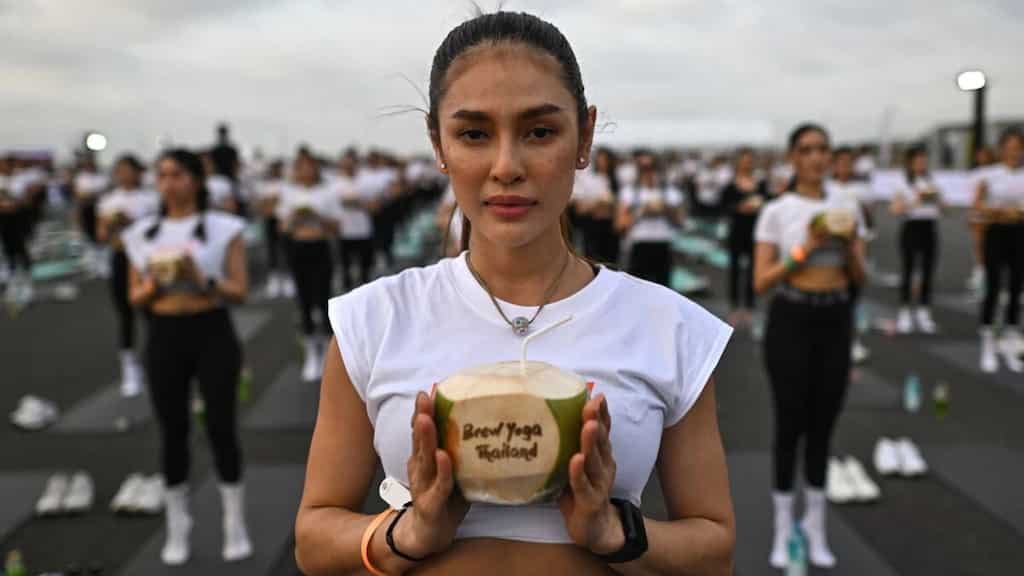 'Feel like a beautiful bird': Mass yoga session takes place on Bangkok airport tarmac