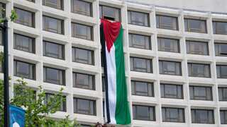 Protesters put up giant Palestinian flag at venue of Biden's White House event