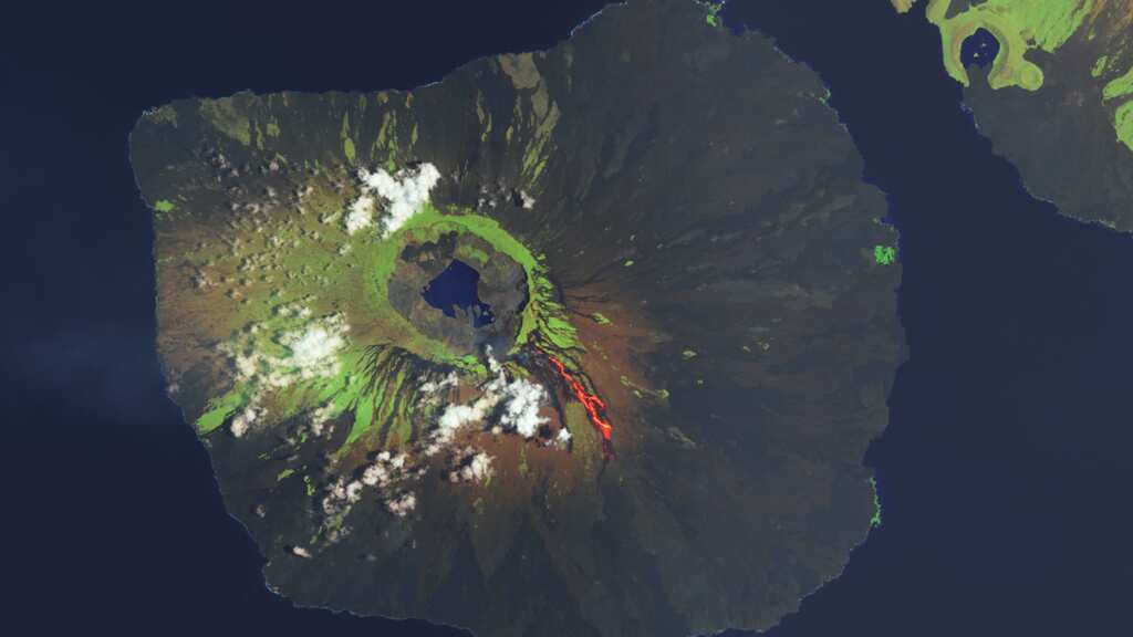 Lava spewing from volcano on Galápagos Islands destroying habitat of rare land iguanas