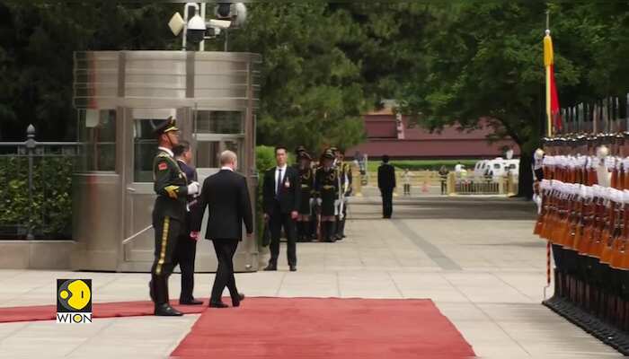 China's Xi Jinping greets Russian President Putin in grand welcome