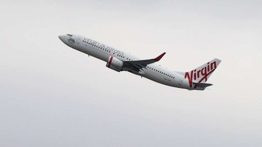 Australian man disrupts flight by running naked in aisle, knocking down crew member