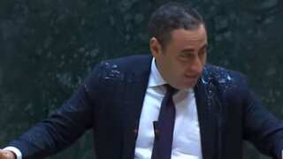WATCH: Water thrown on Georgian leader during fiery Parliamentary debate on foreign influence law