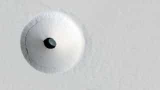 Mysterious hole appears on surface of Mars. What's hiding in there? Aliens?