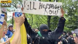 Masked maniac flashes vile ‘Kill Hostages Now’ sign at NYC Israel Day Parade
