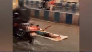 Watch: Man's mattress surfing antics on flooded Pune road go viral amid heavy rains