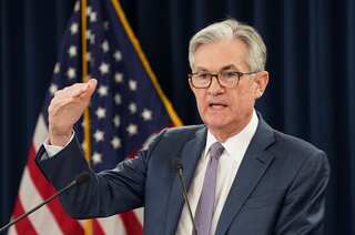 Federal Reserve holds interest rates steady, delays rate cuts