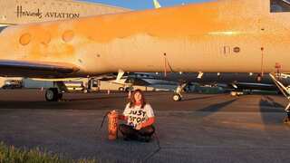 Environmental activists arrested for spraying orange paint on private jets at UK airport