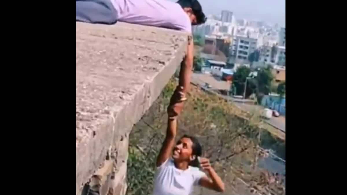 Idiotic stunt to check grip strength: Woman in India's Pune hangs from building holding man's hand. Watch