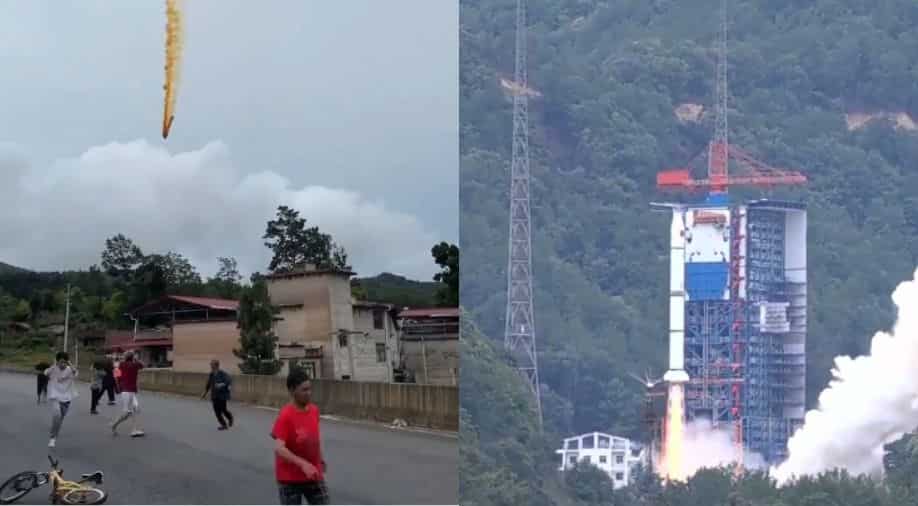 Video: People run for cover as part of Chinese rocket explodes in residential area