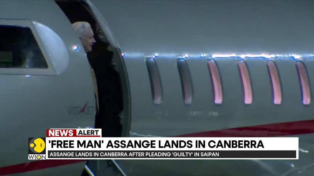 Julian Assange lands in the Australian capital after pleading guilty in Saipan