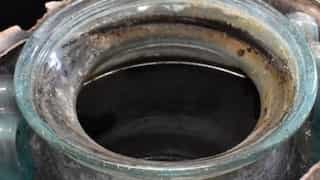 Sealed and filled jar of wine recovered with burials of dead Roman in tomb