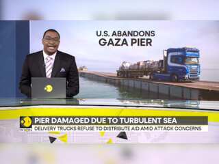 US aid pier temporarily suspends operations