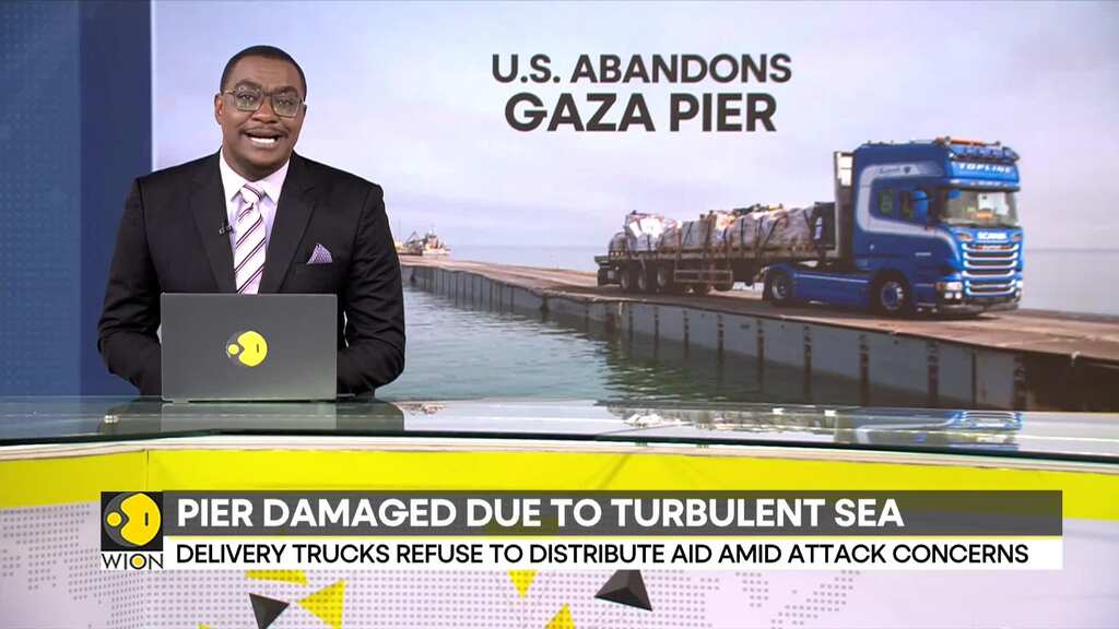 US aid pier temporarily suspends operations