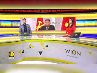 North Korean officials sport Kim Jong Un pins for first time
