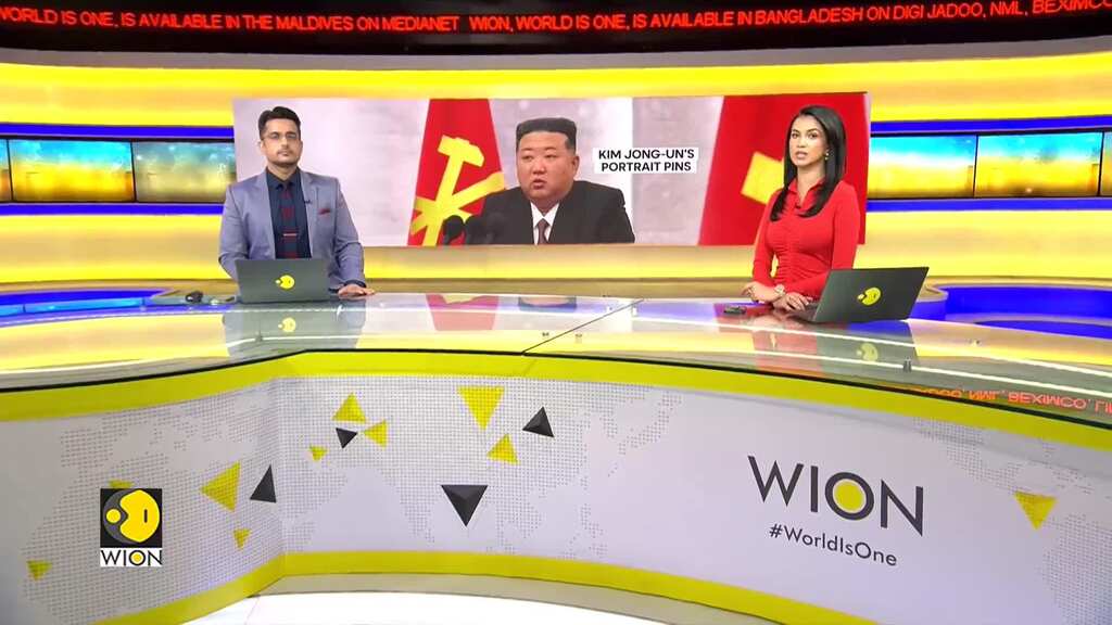 North Korean officials sport Kim Jong Un pins for first time