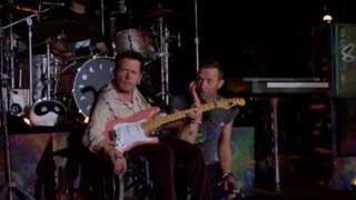 Michael J Fox joins Coldplay for a surprise performance at the Glastonbury Festival