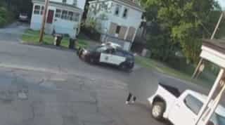 Watch: Man carries dead body on his back the exact moment a police cruiser drives by