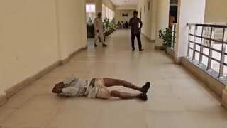 Video: Indian farmer rolls on floor while protesting alleged land occupation by mafia