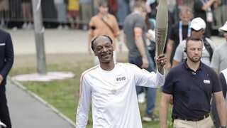 Rapper Snoop Dogg carries Olympic torch through Paris ahead of opening ceremony; see viral pics and videos