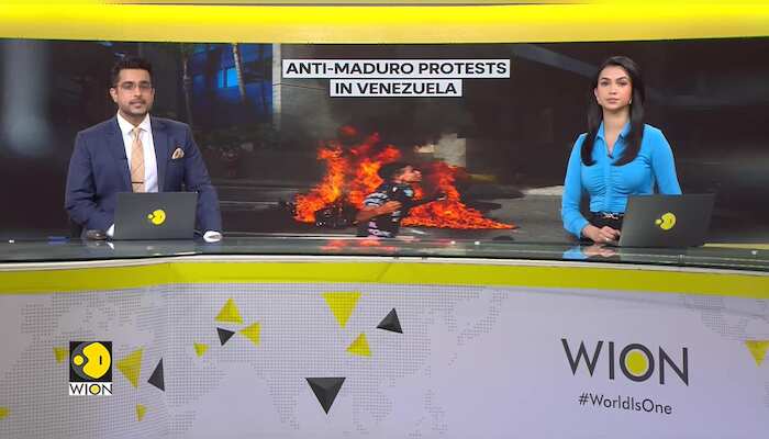 Venezuela Protests: Demonstrators tear down statue, hurl objects at authorities