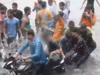 Video: Woman on bike harassed by men on flooded road in Lucknow; 4 arrested