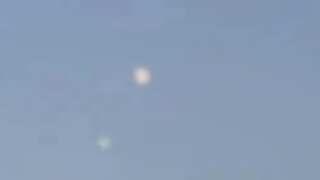 UFO hovering in Spain? Tourists spot mysterious disc flying for seconds in sky