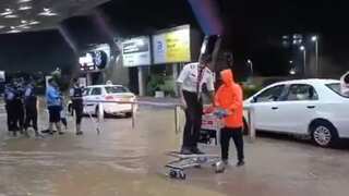 India rains: Pilot rides luggage cart through flooded Jaipur airport | Watch
