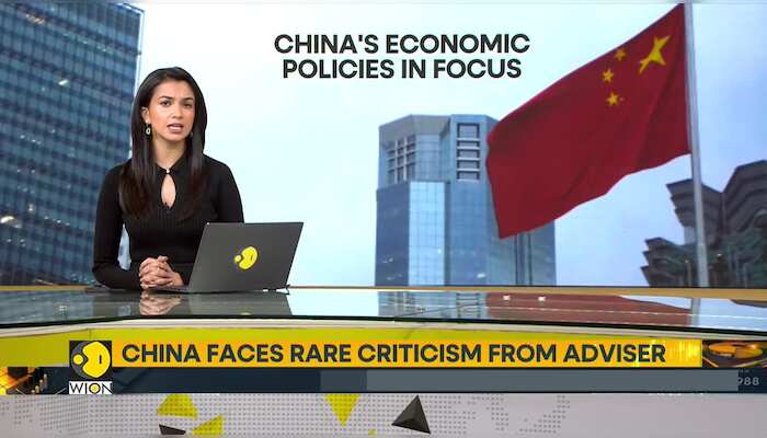 China faces rare criticism from adviser
