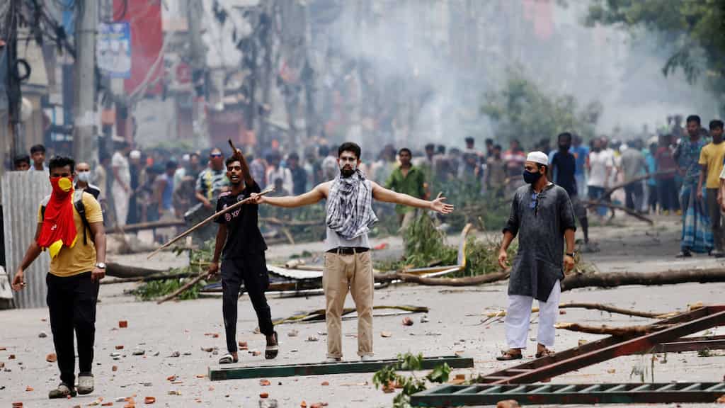 Bangladesh PM Sheikh Hasina 'leaves for safer place' as thousands march to Dhaka