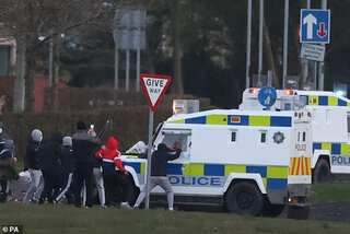 UK violence: 400 arrested, man assaulted in Belfast hate crime; police attacked with petrol bombs