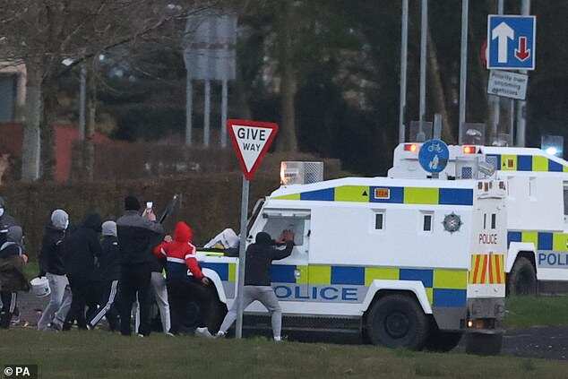 UK violence: 400 arrested, man assaulted in Belfast hate crime; police attacked with petrol bombs