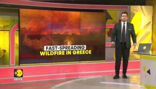 Firefighters battle fast-spreading wildfire near Athens