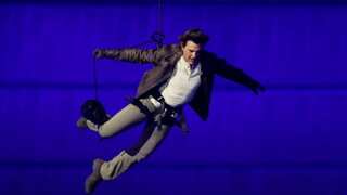 Tom Cruise jumps off roof of stadium in Paris, skydives into LA