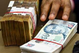 Ex-bankers charged in Singapore’s largest $2.3 billion money laundering case