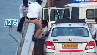 Taxi driver, cops in India's Mumbai save woman from falling into Arabian Sea | VIDEO