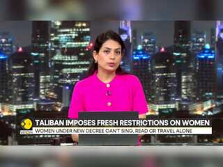 Afghan women under new Taliban's decree can't sing, read or travel alone