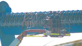 Thirteen people trapped for 90 minutes after a theme park ride stopped mid-air in Australia