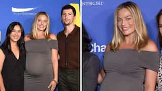 Pregnant Margot Robbie beams with joy as she makes first red carpet appearance with baby bump