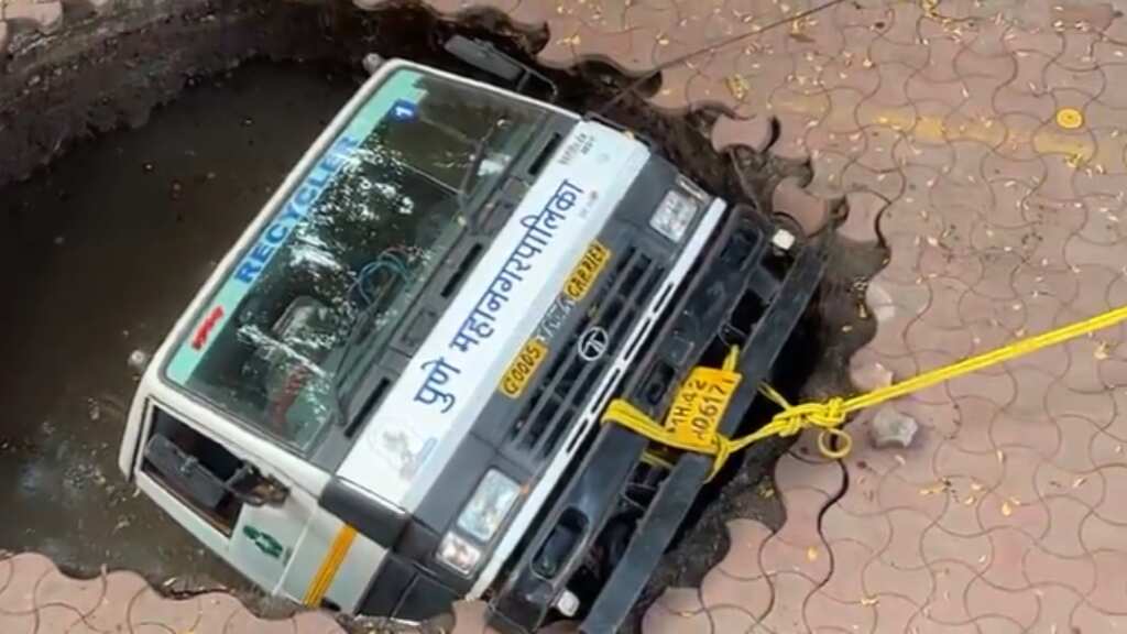 Dramatic video shows civic body truck plunging into sinkhole in India's Pune - WATCH